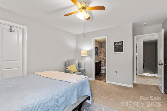 1398 Kent Downs Ave SW Unit 52, Concord, NC 28027 - carpeted bedroom featuring baseboards, connected bathroom, and a ceiling fan