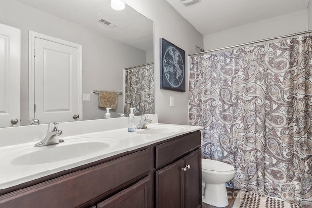 1398 Kent Downs Ave SW Unit 52, Concord, NC 28027 - bathroom featuring double vanity, toilet, and a shower with curtain