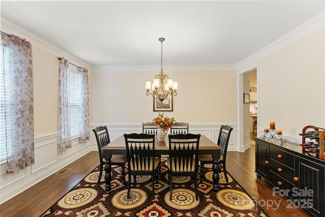 274 Cove Creek Loop, Mooresville, NC 28117 - dining room with a chandelier, dark wood finished floors, ornamental molding, and wainscoting
