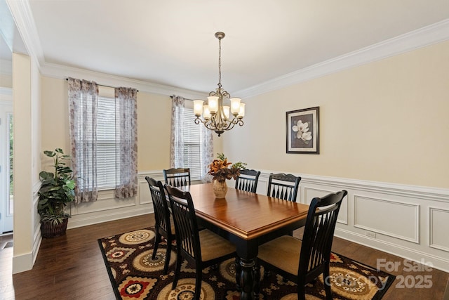 274 Cove Creek Loop, Mooresville, NC 28117 - dining room with a chandelier, dark wood-type flooring, ornamental molding, a wainscoted wall, and a decorative wall