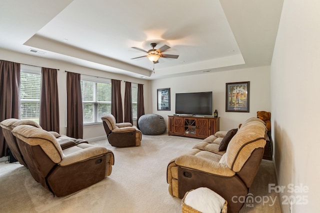 274 Cove Creek Loop, Mooresville, NC 28117 - living area featuring a tray ceiling, light carpet, and ceiling fan
