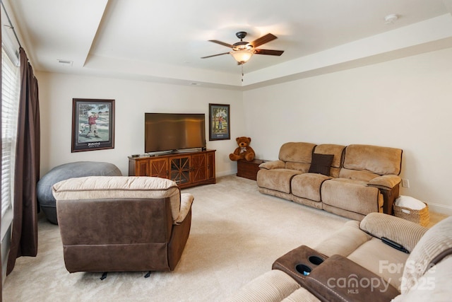 274 Cove Creek Loop, Mooresville, NC 28117 - living room featuring a raised ceiling, light colored carpet, and ceiling fan