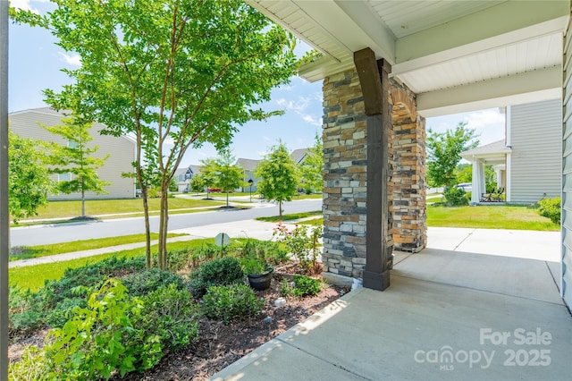 14505 Rhodes Hall Dr, Charlotte, NC 28273 - covered porch with a lawn and a residential view