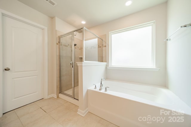 14505 Rhodes Hall Dr, Charlotte, NC 28273 - full bathroom featuring a bath, a shower stall, tile patterned flooring, and recessed lighting