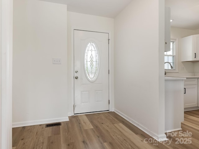 7006 Lone Eagle Dr # 18, Monroe, NC 28110 - foyer entrance featuring light wood-style floors and baseboards