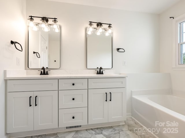 7006 Lone Eagle Dr # 18, Monroe, NC 28110 - full bath featuring double vanity, a garden tub, and marble look tile flooring