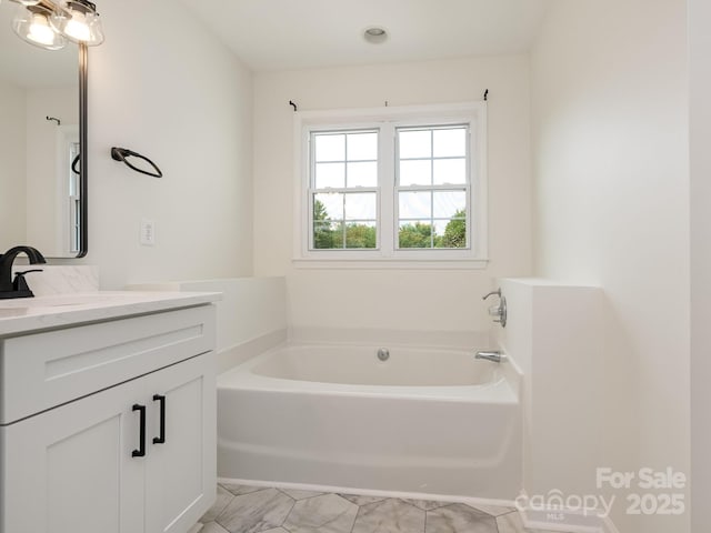 7006 Lone Eagle Dr # 18, Monroe, NC 28110 - bathroom with vanity, a bath, and marble look tiles