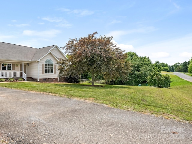 7006 Lone Eagle Dr # 18, Monroe, NC 28110 - view of property exterior with crawl space, a yard, a porch, and roof with shingles