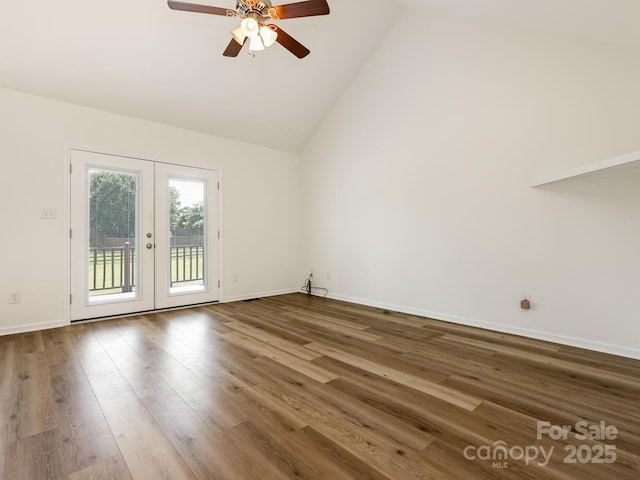 7006 Lone Eagle Dr # 18, Monroe, NC 28110 - spare room with french doors, a ceiling fan, wood finished floors, and high vaulted ceiling