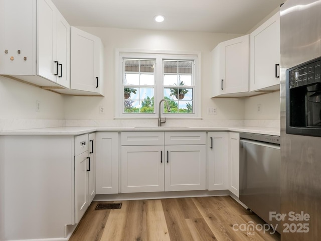 7006 Lone Eagle Dr # 18, Monroe, NC 28110 - kitchen featuring dishwasher, white cabinets, light countertops, and recessed lighting