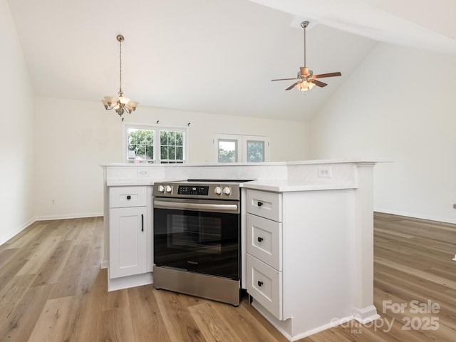 7006 Lone Eagle Dr # 18, Monroe, NC 28110 - kitchen with electric stove, a chandelier, light countertops, light wood finished floors, and ceiling fan