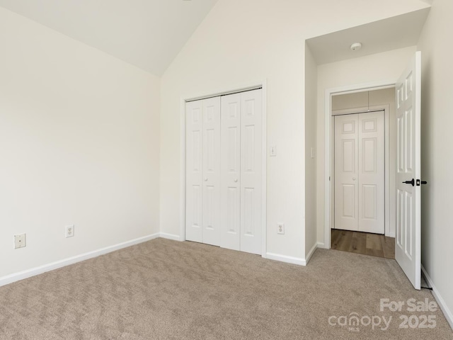 7006 Lone Eagle Dr # 18, Monroe, NC 28110 - unfurnished bedroom with carpet, lofted ceiling, and a closet