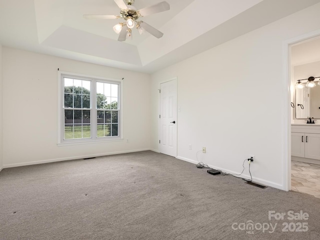 7006 Lone Eagle Dr # 18, Monroe, NC 28110 - carpeted empty room with a tray ceiling and ceiling fan