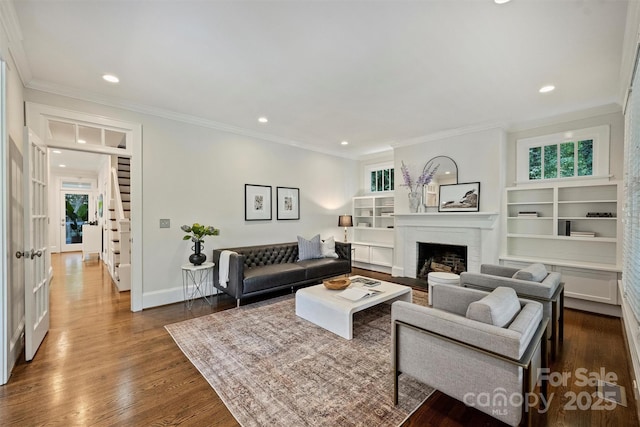2223 Club Rd, Charlotte, NC 28205 - living area with a fireplace, healthy amount of natural light, dark wood finished floors, recessed lighting, and ornamental molding