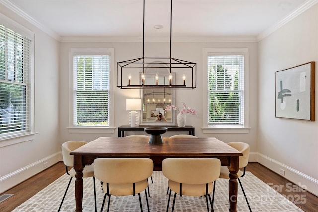 2223 Club Rd, Charlotte, NC 28205 - dining room with a chandelier, healthy amount of natural light, ornamental molding, and wood finished floors