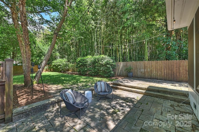 2223 Club Rd, Charlotte, NC 28205 - fenced backyard with a patio