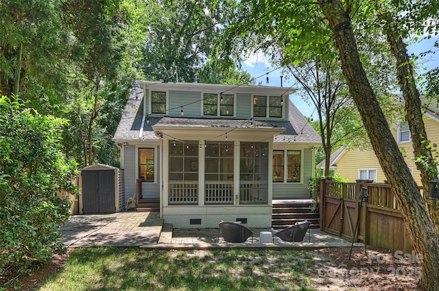 2223 Club Rd, Charlotte, NC 28205 - rear view of property with crawl space, a storage shed, roof with shingles, a patio, and a sunroom