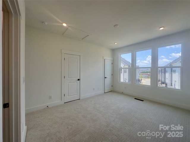 3618 S Tryon St Unit 19, Charlotte, NC 28217 - unfurnished room featuring attic access, carpet floors, and baseboards
