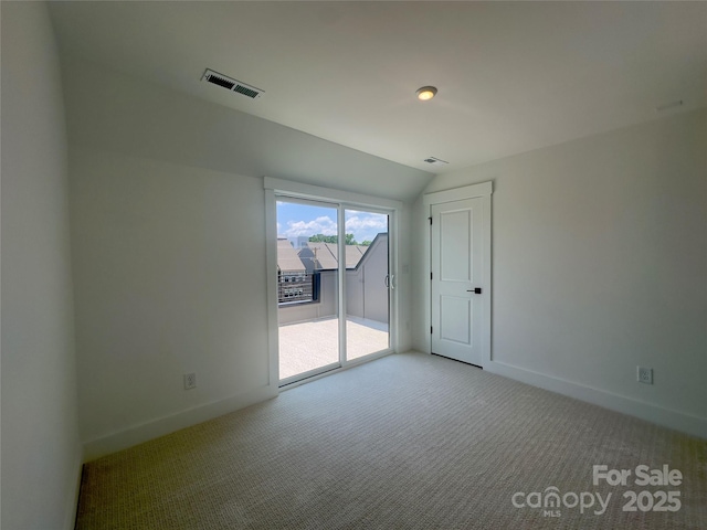 3618 S Tryon St Unit 19, Charlotte, NC 28217 - carpeted spare room with baseboards and vaulted ceiling