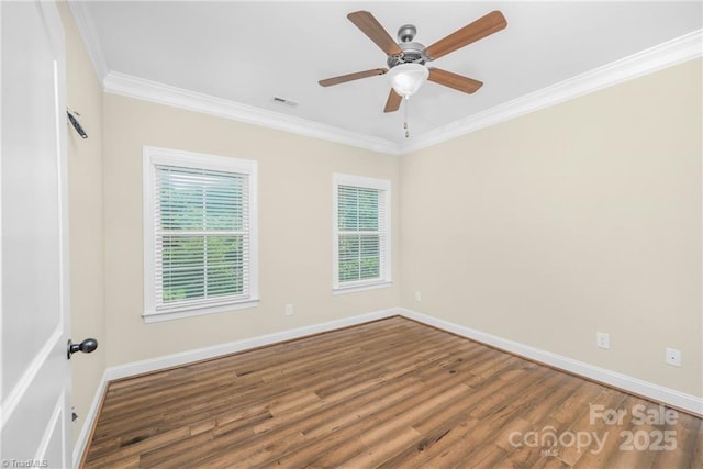 202 Watchtower Ct, Winston Salem, NC 27127 - spare room featuring plenty of natural light, ornamental molding, wood finished floors, and baseboards