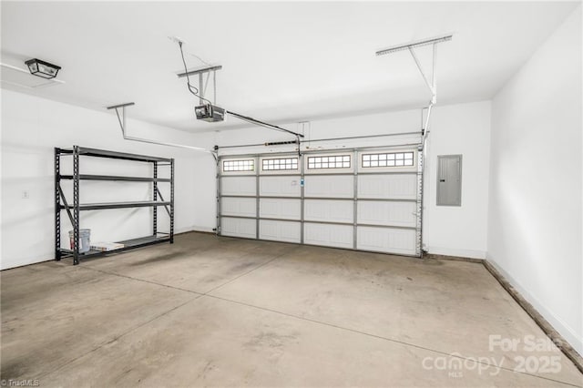 202 Watchtower Ct, Winston Salem, NC 27127 - garage featuring electric panel, baseboards, and a garage door opener
