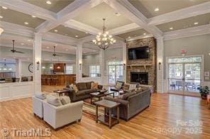 202 Watchtower Ct, Winston Salem, NC 27127 - living area featuring wood finished floors, a ceiling fan, plenty of natural light, beamed ceiling, and coffered ceiling