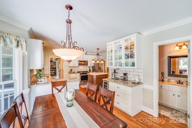 10127 Tallent Ln, Huntersville, NC 28078 - dining area with ornamental molding and light wood-type flooring