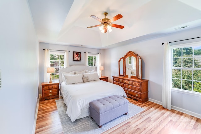 10127 Tallent Ln, Huntersville, NC 28078 - bedroom featuring light wood-style floors, baseboards, a tray ceiling, and a ceiling fan