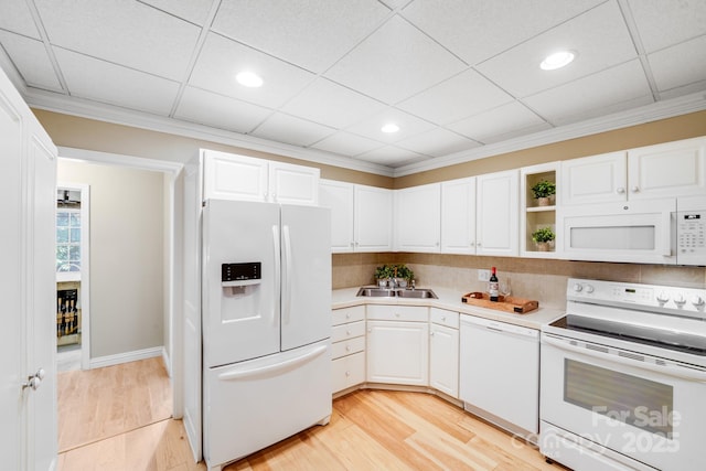 10127 Tallent Ln, Huntersville, NC 28078 - kitchen featuring white appliances, white cabinets, light countertops, light wood-style flooring, and crown molding