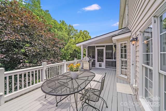 10127 Tallent Ln, Huntersville, NC 28078 - wooden deck featuring a sunroom, outdoor dining area, and grilling area