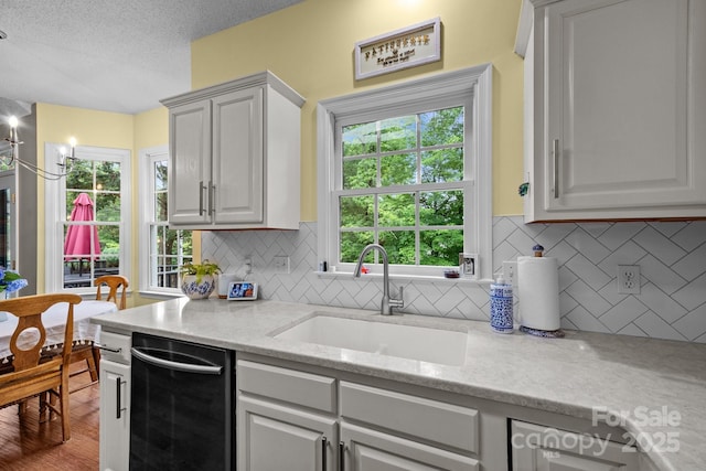 201 Windsor Forest Cir, Fletcher, NC 28732 - kitchen featuring dishwashing machine, tasteful backsplash, a textured ceiling, and light stone counters