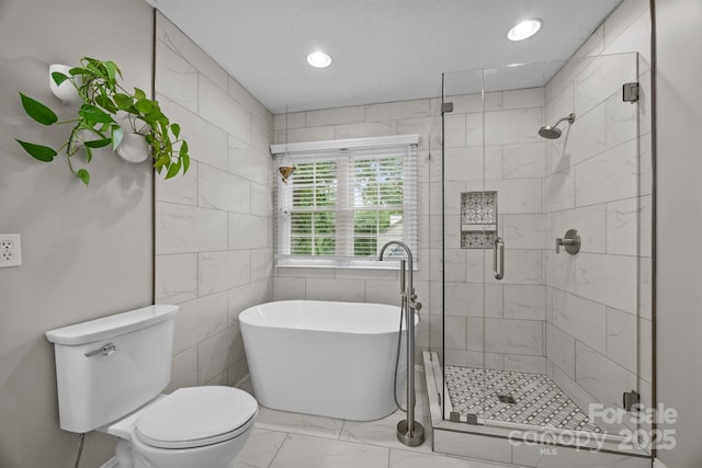 201 Windsor Forest Cir, Fletcher, NC 28732 - full bathroom with a soaking tub, marble finish flooring, a stall shower, tile walls, and recessed lighting