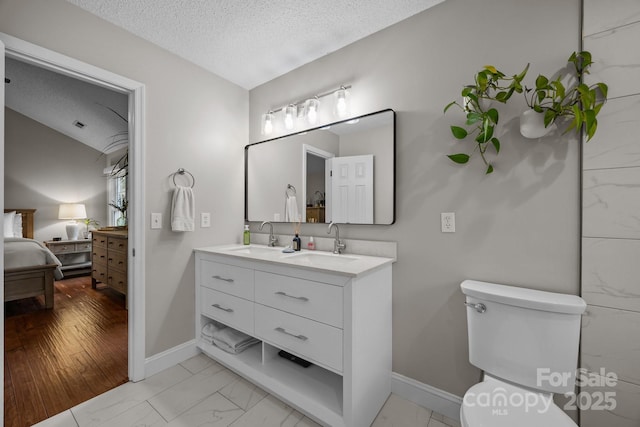 201 Windsor Forest Cir, Fletcher, NC 28732 - ensuite bathroom with double vanity, marble finish flooring, and a textured ceiling