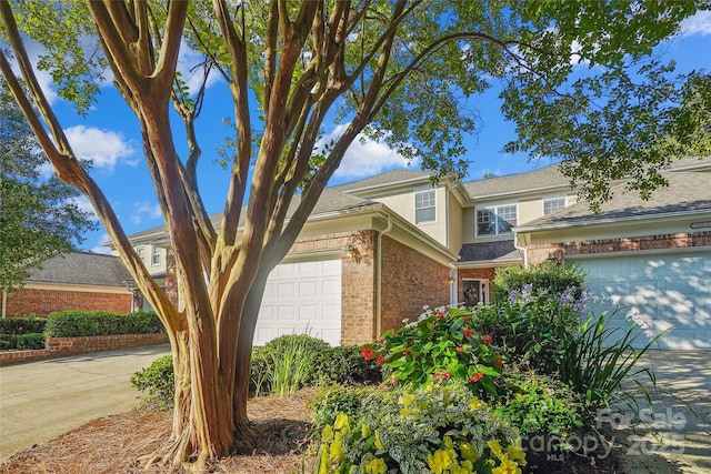 11234 Villa Trace Pl, Charlotte, NC 28277 - traditional-style house featuring brick siding, a garage, and stucco siding