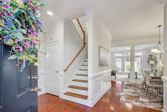 11234 Villa Trace Pl, Charlotte, NC 28277 - entrance foyer with crown molding, stairs, wood finished floors, wainscoting, and french doors