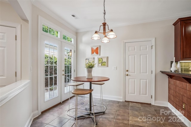 11234 Villa Trace Pl, Charlotte, NC 28277 - dining space featuring a chandelier, french doors, and crown molding