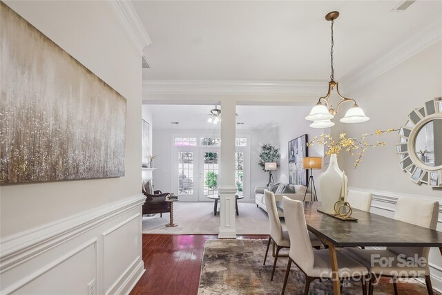 11234 Villa Trace Pl, Charlotte, NC 28277 - dining space featuring crown molding, dark wood finished floors, ceiling fan, and a chandelier