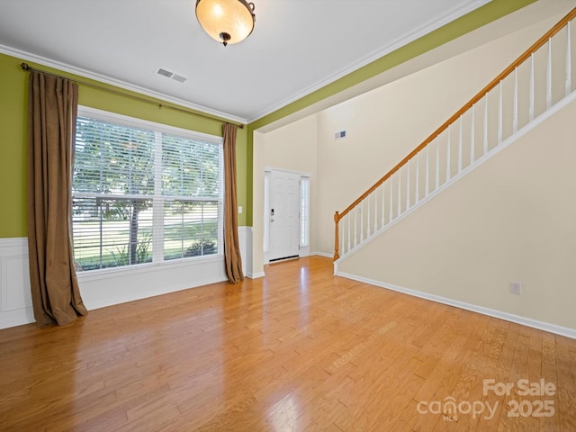 5921 Firethorne Ln, Concord, NC 28025 - foyer entrance with ornamental molding, stairs, wood finished floors, and baseboards