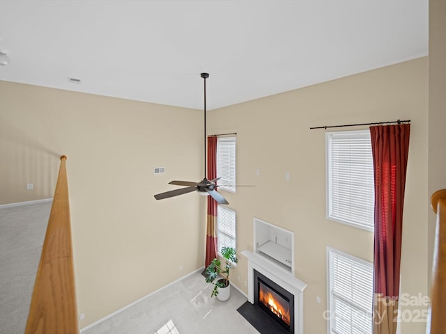 5921 Firethorne Ln, Concord, NC 28025 - detailed view of carpet floors, a fireplace with flush hearth, baseboards, and a ceiling fan