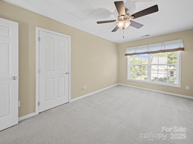 5921 Firethorne Ln, Concord, NC 28025 - unfurnished bedroom with attic access, carpet floors, and baseboards