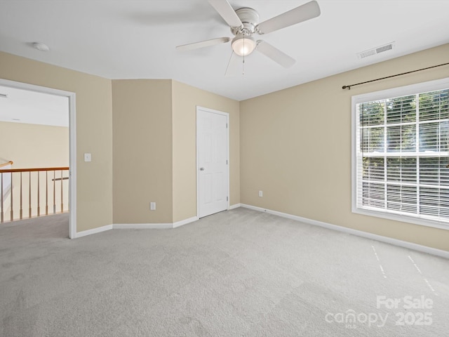 5921 Firethorne Ln, Concord, NC 28025 - spare room with light carpet, ceiling fan, baseboards, and a smoke detector