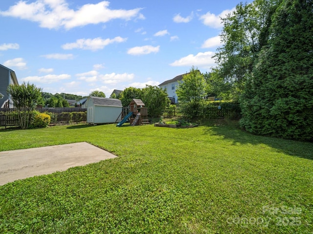 5921 Firethorne Ln, Concord, NC 28025 - view of yard with a patio area and a playground