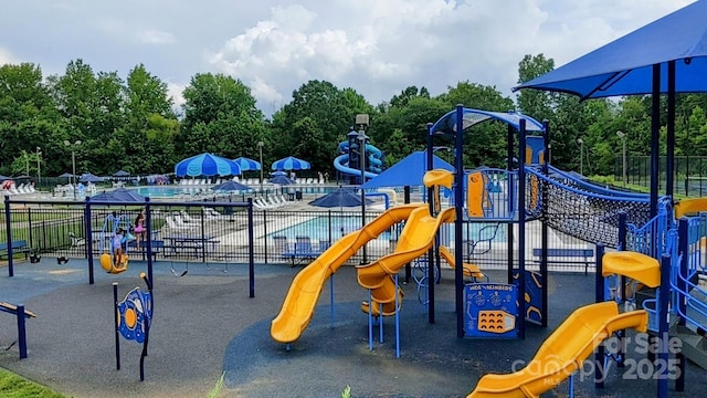 1418 Skidaway St NW Unit 427, Concord, NC 28027 - community playground featuring a community pool and view of scattered trees