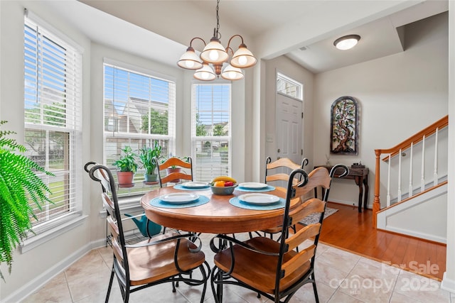 1418 Skidaway St NW Unit 427, Concord, NC 28027 - dining area featuring healthy amount of natural light, a chandelier, and stairway