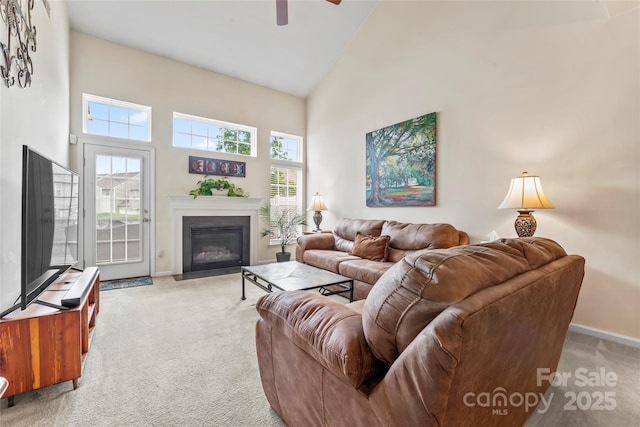 1418 Skidaway St NW Unit 427, Concord, NC 28027 - living room with high vaulted ceiling, light colored carpet, a ceiling fan, and a fireplace with flush hearth