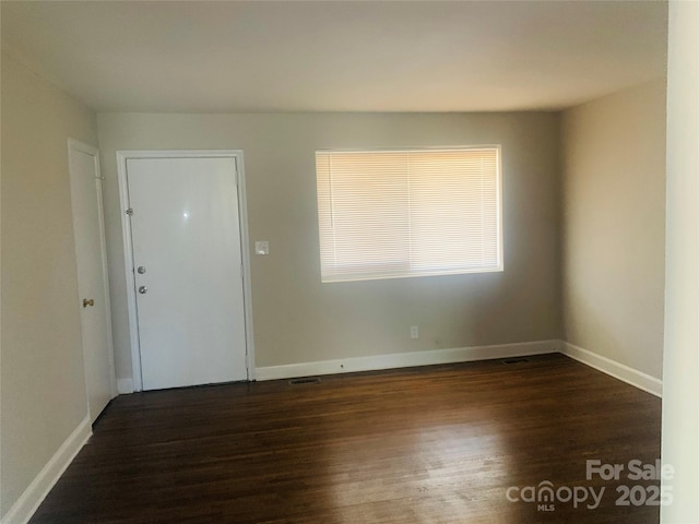 1211 Campus St, Charlotte, NC 28216 - entrance foyer with dark wood finished floors and baseboards