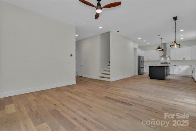 127 View Ridge Parkway, Leicester, NC 28748 - unfurnished living room featuring ceiling fan, light wood-type flooring, stairs, and recessed lighting