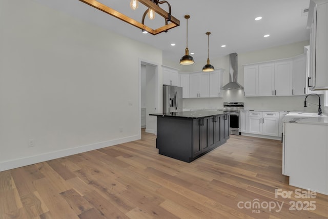127 View Ridge Parkway, Leicester, NC 28748 - kitchen with wall chimney exhaust hood, appliances with stainless steel finishes, white cabinetry, recessed lighting, and light wood-style flooring