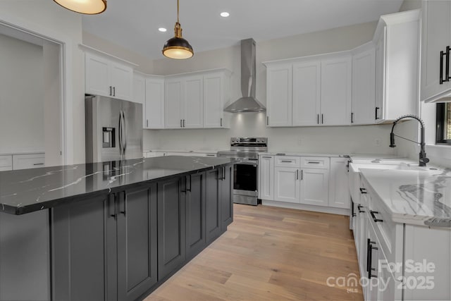 127 View Ridge Parkway, Leicester, NC 28748 - kitchen featuring appliances with stainless steel finishes, wall chimney range hood, white cabinets, recessed lighting, and dark stone countertops