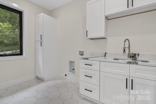 127 View Ridge Parkway, Leicester, NC 28748 - laundry area with hookup for a washing machine, cabinet space, light tile patterned floors, and electric dryer hookup